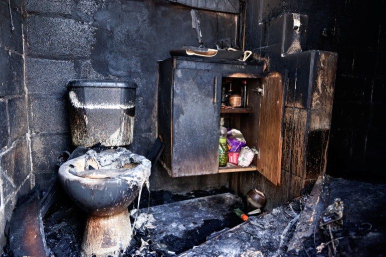 Bathroom inside a house destroyed by a forest fire