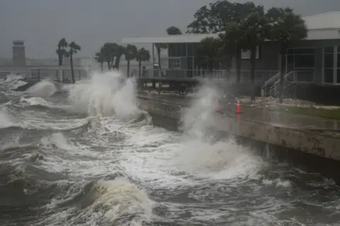 AFP Waves crashing onto the shore