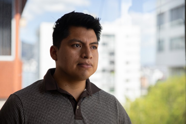 Brandon Samuiza takes a photo outdoors in Quito